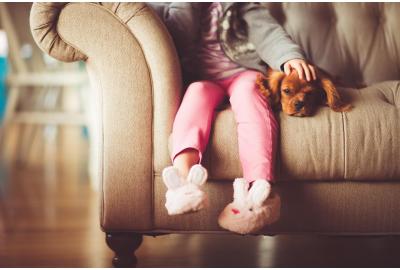 young_childs_legs_hanging_off_a_sofa